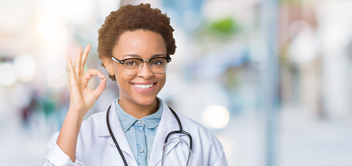 Healthcare symbols on wooden blocks beside a stethoscope representing regulatory and administrative adaptability